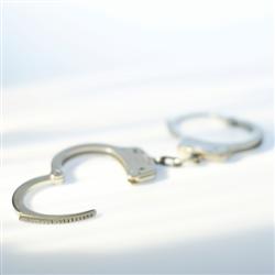 Handcuffs On a Jail Bench